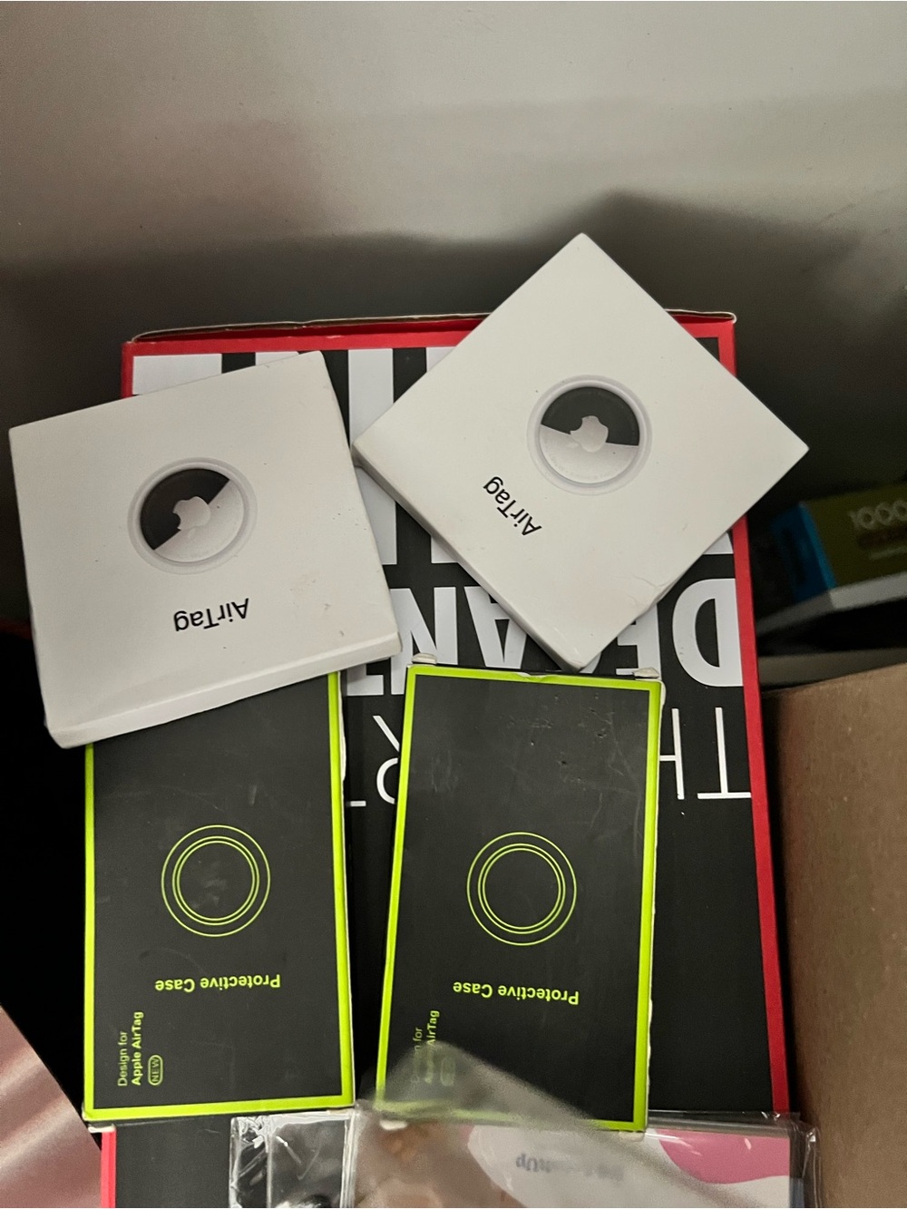 Spigen Protective AirTag Cases with Neon Green Accents